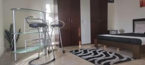 a bedroom with a bed and a glass bunk bed at La douce in Sousse