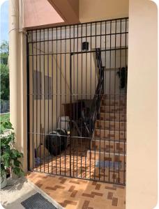 a metal gate with a staircase in a house at Studio Apartment in Mactan,Cebu Room203 in Lapu Lapu City