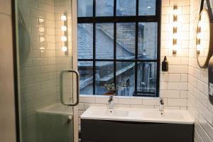 a bathroom with a sink and a window at CODE - The Loft, Edinburgh in Edinburgh +41 photos
