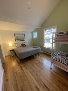 a bedroom with a bed and a bunk bed at Santa Cruz Hostel in Santa Cruz