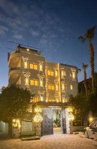 a building with christmas lights in front of it at Solima pyramids inn in Cairo