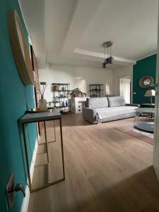 a living room with a couch and a table at San Clemente guest house in Padova