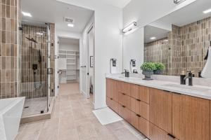 a bathroom with two sinks and a shower at Serengeti Suite in Downtown Eagle in Eagle