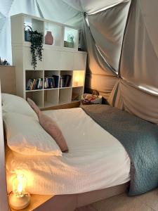 a bedroom with a bed in a tent at The Dome at Midauchengowan in Lochwinnoch