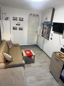 a living room with a couch and a table at Casa Al Colle in Pescocostanzo +17 photos