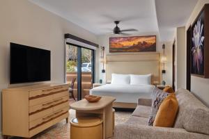a hotel room with a bed and a television at Hyatt Vacation Club at Pinon Pointe, Sedona in Sedona