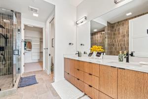 a bathroom with a double sink and a shower at Emerald City in Downtown Eagle in Eagle +20 photos