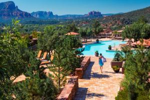 a woman walking by a pool at a resort at Hyatt Vacation Club at Pinon Pointe, Sedona in Sedona