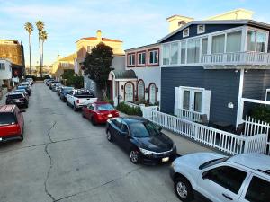 a group of cars parked in a parking lot at LB Peninsula Steps to Beach close to in Long Beach +43 photos