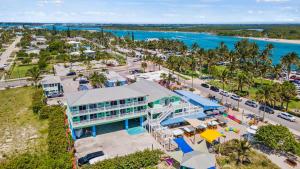 an aerial view of a building next to the ocean at Oceanfront Inn Room #9 in Fort Pierce