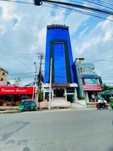 a blue building on the side of a street at Hotel Istanbul Sylhet in Sylhet