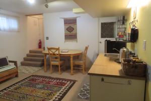 a kitchen and dining room with a table and a dining room at Friendly Footprint in Golden