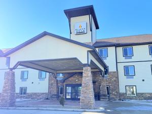 a hotel with a sign on the front of it at Black Gold Suites Stanley in Stanley