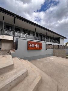 a building with a sign on the side of it at Boho Suites in Tafí del Valle