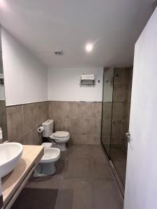 a bathroom with two toilets and a shower at Boho Suites in Tafí del Valle +12 photos