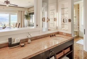 a bathroom with a sink and a large mirror at Sttupa Estate Napa Valley in Napa +23 photos