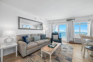 a living room with a couch and a table at Perdido Skye 64 in Pensacola +34 photos