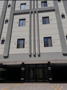 a building with the doors open on a building at Modern Apartment 3 in Jeddah