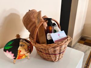 a basket with a bottle of wine on a table at Ayu Aanandam - Live I Heal I Rest in Rishīkesh