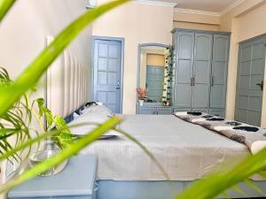a bedroom with a bed and a mirror at Ayu Aanandam - Live I Heal I Rest in Rishīkesh