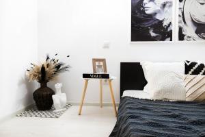 Un pat sau paturi într-o cameră la Social Vibe Loft