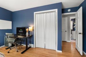 a room with a desk and a white radiator at The Nicollet Nook Unit 2 in Minneapolis