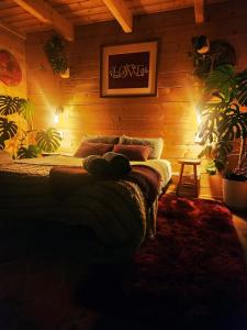 a bedroom with a bed in a wooden wall at Twizel Ecostays in Twizel