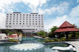 a hotel with a pool in front of a building at Sai Gon Dong Ha Hotel - a member of Saigontourist Group in Quang Tri