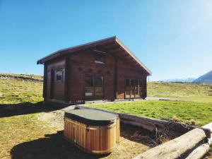 a small house with a trash can in front of it at Twizel Ecostays in Twizel