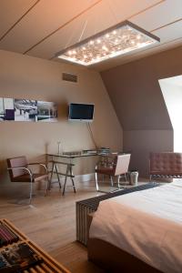 TV a/nebo společenská místnost v ubytování Hotel Recour