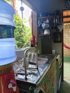 a kitchen with a sink and a counter top at Recanto BantuArte-Boipeba in Cairu +24 photos