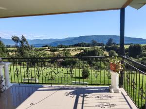 a view from the balcony of a house at Regreso al Encanto in Puyehue