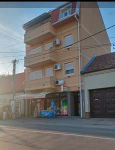 a tall building on the side of a street at Centro apartman 3 in Pančevo