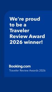 a blue sign that says were proud to be a traveler reviewagency winner at Amazing beachfront condo at Tides on Hollywood Beach Luxury Resort in Hollywood