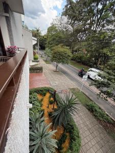 a view of a street from a balcony of a house at Hotel Balcones De Malibu in Medellín
