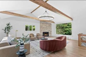 a living room with a couch and a fireplace at Renovated Retreat with Heated Pool in Redding
