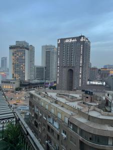 a view of a city with tall buildings at Deluxe Apartment Partial Nile View in Cairo
