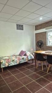 a living room with a couch and a table at Casa Del Valle Traslasierra in Las Chacras (La Paz)