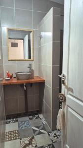 a bathroom with a sink and a mirror at Casa Del Valle Traslasierra in Las Chacras (La Paz) +23 photos