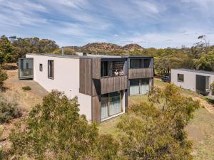 an aerial view of a house with a balcony at Piermont Retreat in Swansea
