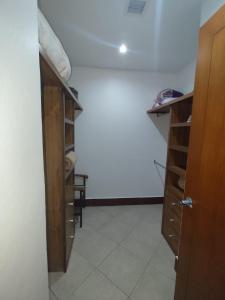a room with a closet with a wooden cabinet at BVG Villa 1 Norte in Ixtapa +25 photos