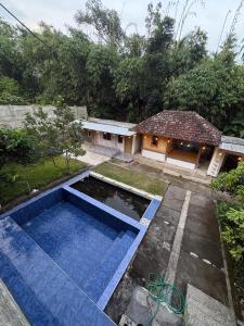 a house with a swimming pool in a yard at NH Villa in Sangyang