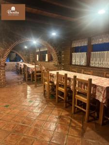 a row of tables and chairs in a restaurant at Quinta Bonita in Zacatlán
