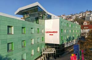 a building with a sign on the side of it at Leonardo Hotel Esslingen in Esslingen