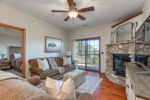 a living room with a couch and a fireplace at 2BR Village At Indian Point 1202 near SDC-Free Tickets Daily up to $500 in Branson