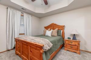 a bedroom with a bed and a dresser and a window at 2BR Village At Indian Point 1202 near SDC-Free Tickets Daily up to $500 in Branson +13 photos