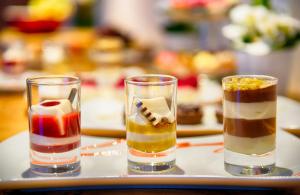 a tray with three different types of desserts at Leonardo Hotel Düsseldorf City Center in Düsseldorf
