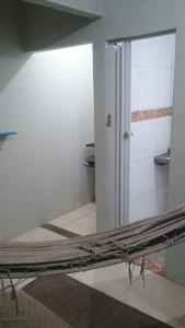 a view of a room with a door and a mirror at Ap do Jhone in Canoa Quebrada