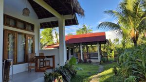a house with a red roof at Greenfield-Lombok in Tetebatu