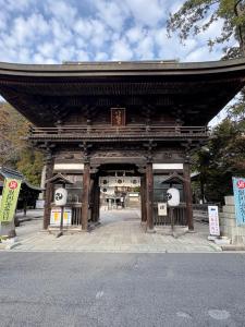 a pagoda with an entrance to a building at 日牟禮乃宿 日牟禮八幡宮徒歩4分ラコリーナ車4分 in Omihachiman
